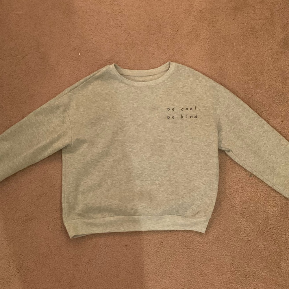 a grey sweater